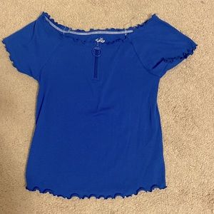 A blue ruffle top with zipper